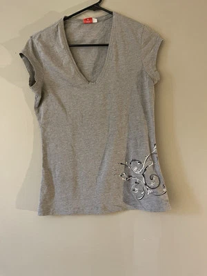 Camiseta deportiva para mujer Puma talla M gris cuello en V usada Foto 1 de 4