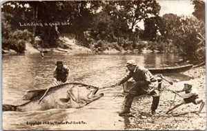 1910s RPPC Postcard Landing One Kansas City KS Exaggeration Fishing Huge Fish - Picture 1 of 2