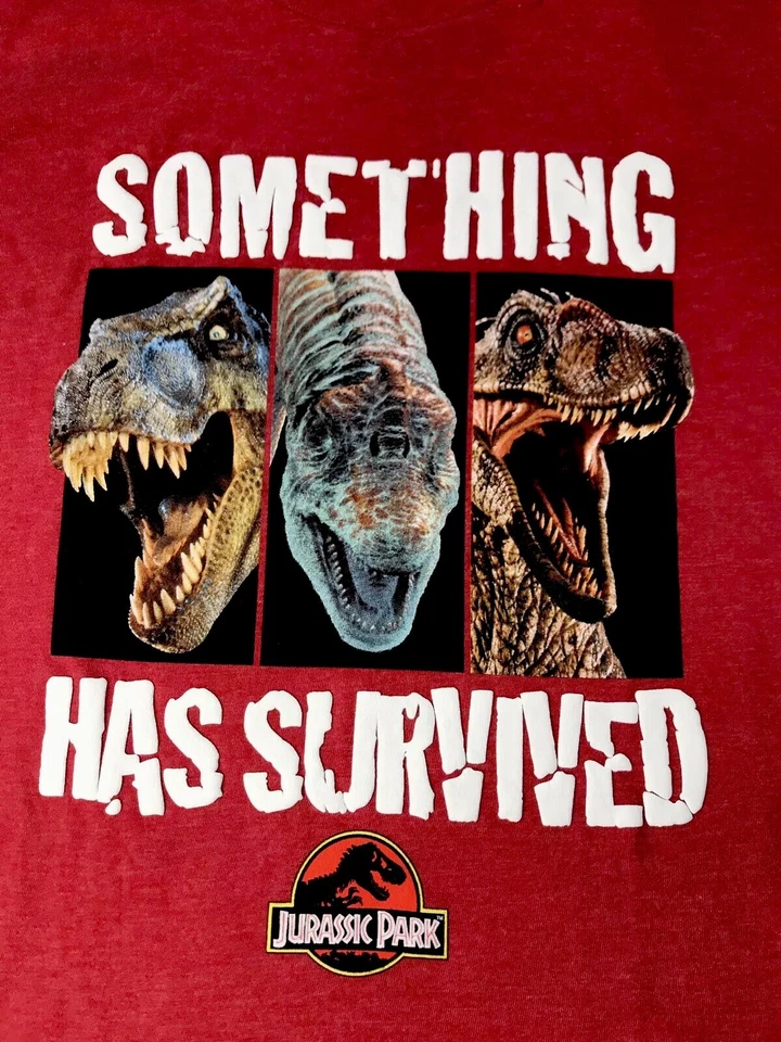 Camiseta roja Jurassic World Boys CL 14-16 Something Has Survives T-Rex Raptor S/S Foto 1 de 4