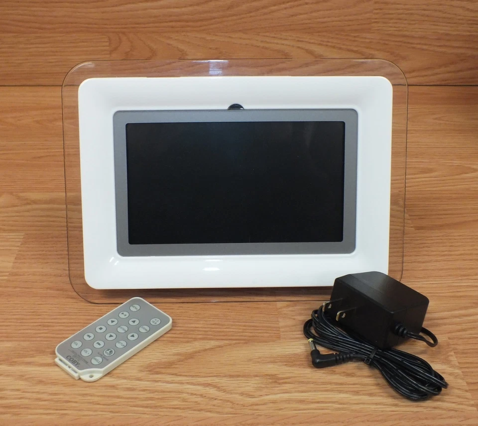Genuine Coby (DP-772) White 7" (Inch) Screen Digital Photo Frame w/ MP3 Player - Image 1 of 4