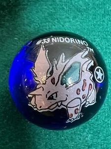 Vintage Pokemon #33 Nidorino 1st First Edition Blue Clear Glass Marbles ToyBiz - Picture 1 of 4