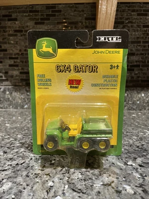 Vehículo de plástico John Deere Gator 2003 ERTL 15411 escala 1:64 nuevo en paquete Foto 1 de 4