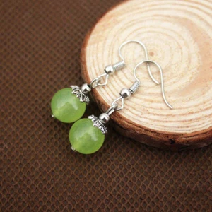 A PAIR OF DANGLY 10MM GREEN PERIDOT BEAD EARRINGS WITH 925 SILVER HOOKS NEW - Picture 1 of 1