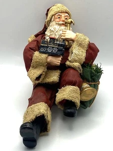 Weihnachtsmann hält Hammer und Zug Strumpfhalter Mantel - Bild 1 von 6