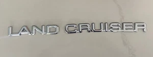Toyota Land Cruiser 2003-2009 emblemas de puerta trasera insignia símbolo logotipo OEM (2005) - Imagen 1 de 3
