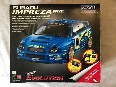 VOITURE RADIOCOMMANDE NIKKO SUBARU IMPREZA WRC SUPER EVOLUTION 1/10 EN BOITE - Photo 1/4