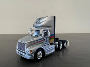 1/64 DCP /First Gear International 9100i Day Cab-Silver (JJ Keller) - Picture 1 of 8
