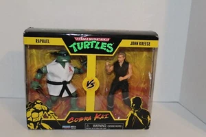 Teenage Mutant Ninja Turtles TMNT Raphael vs. John Kreese Cobra Kai Figures NIB - Picture 1 of 5