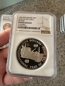 Piefort 1983 Solomons S$5 Argento Anno del Bambino NGC Proof Dettagli Pulito - Foto 1 di 5