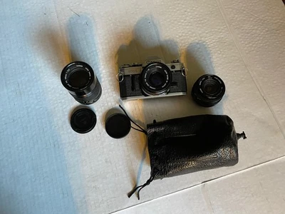 Cámara fotográfica Canon AE-1 y lentes y folletos Foto 1 de 4