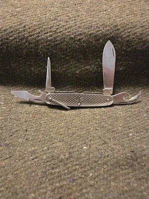 Cuchillo militar plegable de cuatro herramientas de acero inoxidable Camillus 1968 EE. UU. Foto 1 de 4