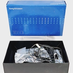 Boîte et accessoires d'origine Sony Ericsson T650i - Manuel/support de charge - Photo 1/11
