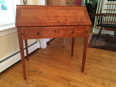 A hand crafted Shaker styled fold down top writing desk designed by Thomas Moser Cover