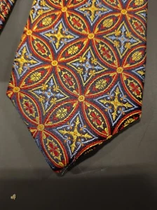 Cravatta seta Haines & Bonner fiore geometrico arancione con accenti blu e oro - Foto 1 di 10