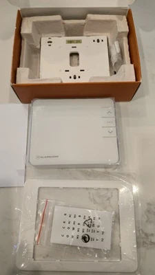 alarm.com T2000 smart Zwave thermostat is new in  factory box,box shows wear - Image 1 of 4