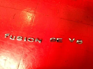 06-09 FORD FUSION SE V6 EMBLEMA MALETERO TRASERO INSIGNIA MARCA NOMBRE LOGOTIPO CONJUNTO FABRICANTE DE EQUIPOS ORIGINALES - Imagen 1 de 5