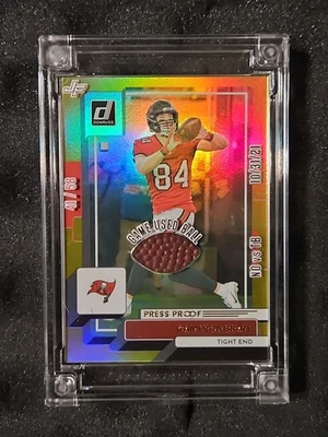 Cameron Brate Press Proof Gold 41/58 Games Used Ball NO vs TB - 10/31/21 - Image 1 of 4