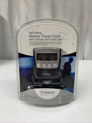 Reloj de viaje atómico autoajustable Oregon Scientific con calendario y estuche de viaje Foto 1 de 2