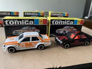 2 X RARE VINTAGE TOMY TOMICA 38 1/60 MITSUBISHI LANCER RALLY IN BLACK & WHITE - Picture 1 of 12