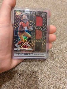 2021 Panini Obsidian Trey Sermon Rookie Trifecta Material 27/75 - Picture 1 of 3