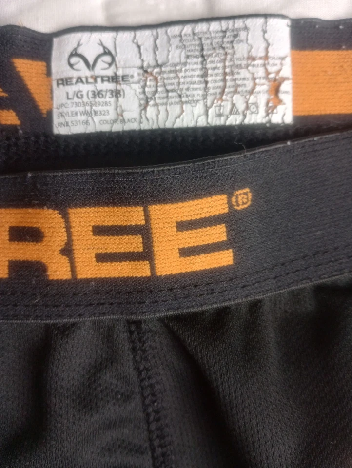 Parte inferior de capa base grande RealTree para hombre mosca abierta negra con logotipo naranja  Foto 1 de 4