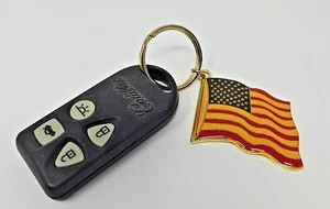 CADILLAC KEY LESS ENTRY REMOTE FOB KEYFOB AUTO 4-BUTTON GRAY SEDAN ALARM USA - Picture 1 of 3