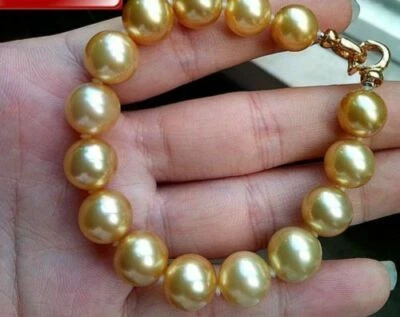 AAA++ 11-12 mm natural gold  pearl bracelet 7.5-8 inch silver - Image 1 of 2