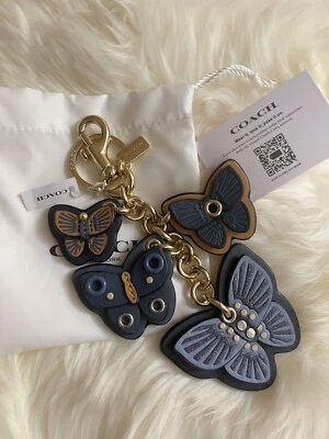 COACH Butterfly Cluster Mix Bag Charm Llavero Dorado/Azul Denim Nuevo con Etiquetas Foto 1 de 4