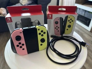 Nintendo Switch Joy-Con Pair (Pink / Gelb) + Joy-Con Charging Grip (Ladestation) - Bild 1 von 10