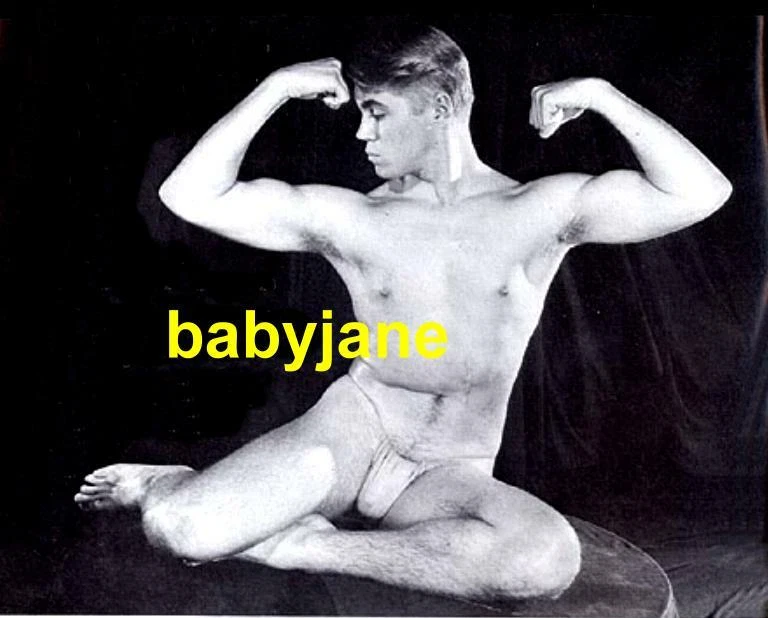 021 DENNIS COLE EARLY PHYSIQUE MODELING SEMI NUDE WEARING A POSING STRAP PHOTO - Image 1 of 1