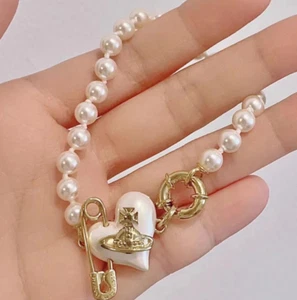 Vivienne Westwood Pearl Saturn/Gold Bracelet - Picture 1 of 8