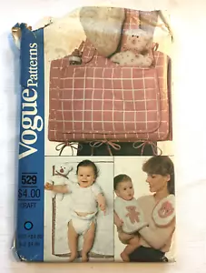 Vogue Patterns 529 Wickeltasche Wickelunterlage Lätzchen Spielzeug Zubehör Muster UNGESCHNITTEN - Bild 1 von 5