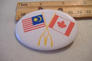 ~MCDONALDS~MALAYSIA & CANADA FLAGS~OVAL BUTTON PIN~ - Picture 1 of 2