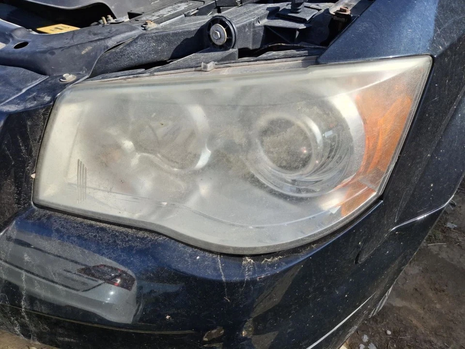 Faro de conductor Chrysler Town & Country 2013 OEM HID bisel cromado usado Foto 1 de 1