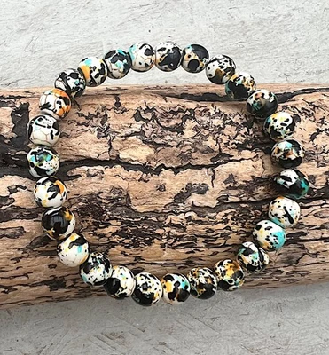 Armband Perlenarmband elastisch synth. Türkis gemustert weiss schwarz orange bl. - Bild 1 von 2