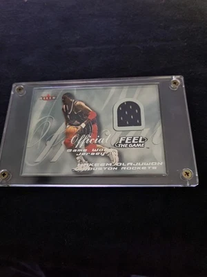 HAKEEM OLAJUWON 2000-01 FLEER SKYBOX FEEL THE GAME OFFICIAL GAME WORN JERSEY !!! - Image 1 of 2