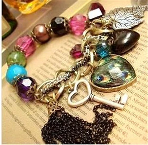 Vintage peacock eye feather heart key leaf chain bracelet - Picture 1 of 2