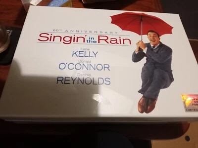 Singing in the Rain 60th Anniversary  includes Book, Umbrella and Advertising  - Image 1 of 4