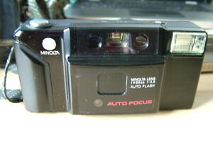 Minolta AF-E Auto Focus 35mm Film Camera with Auto Flash..