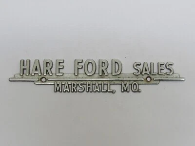 Insignia de metal vintage de concesionario Liebre Ford Sales Marshall Missouri emblema etiqueta maletero MO Foto 1 de 2