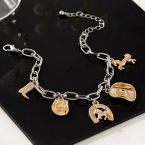 HORSE EQUESTRIAN JEWELLERY JEWELLERY COWGIRL CHARMS  BRACELET SILVER & GOLD TONE - Bild 1 von 4