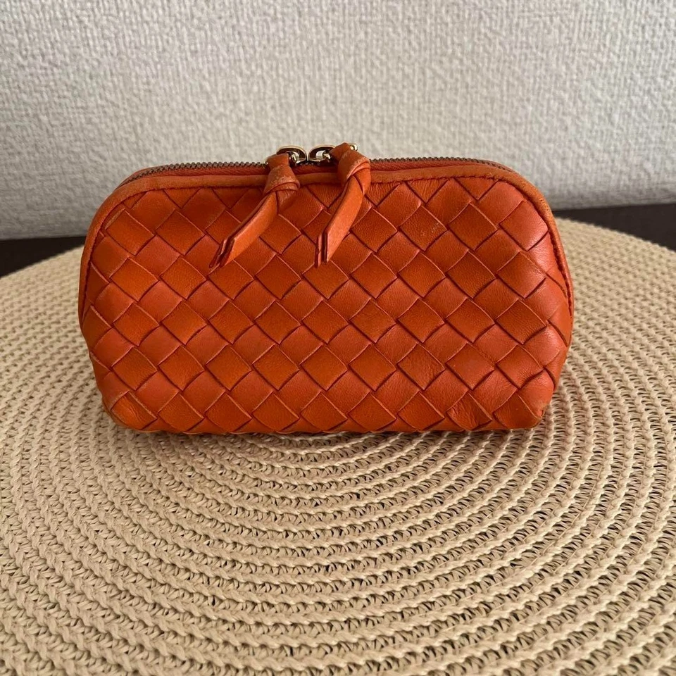Bolsa Bottega Veneta Intrecciato en Hermes Naranja con Cremallera Dorada. Foto 1 de 4