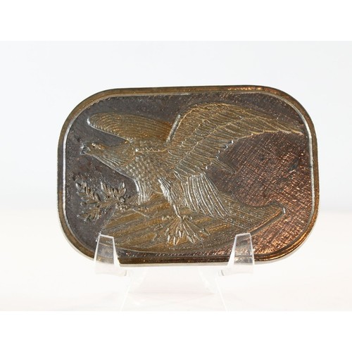 Flying Eagle silver belt buckle with gold overtones, bronze eagle design, and laurel wreath on textured metal plate.