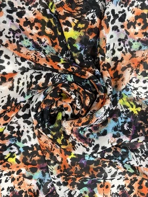 Vibrante tela de gasa multicolor con estampado de leopardo - Ligera no elástica transparente Foto 1 de 4
