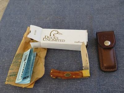 Cuchillo Schrade EE. UU. 2003 PATOS ILIMITADOS SDU-50 BLOQUEO HOJA TRASERA MANGO MADERA NUEVO EN CAJA Foto 1 de 4