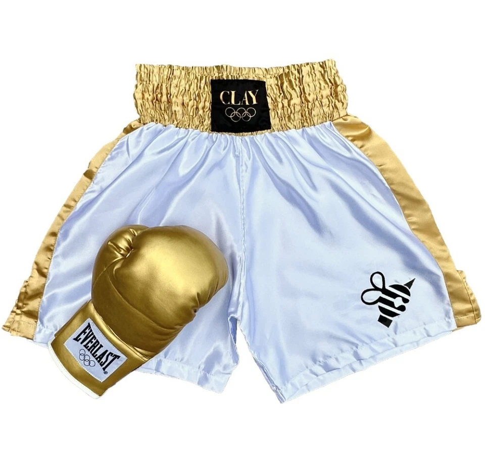 Juego de baúles de oro y guante dorado Muhammad Ali Cassius de arcilla 1960 Juegos Olímpicos Foto 1 de 4