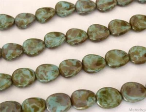 25 12 x 9 mm Czech Glass Twisted Flat Oval Beads: Opaque Light Blue - Picasso - Picture 1 of 1