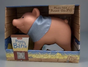 Hucha Schylling Penny the Pig vinilo suave durable cabeza móvil enchufe giratorio - Imagen 1 de 8
