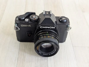 Cámara fotográfica Chinon CM-4 35 mm SLR con lente Chinon automática de 50 mm sin probar - Imagen 1 de 7