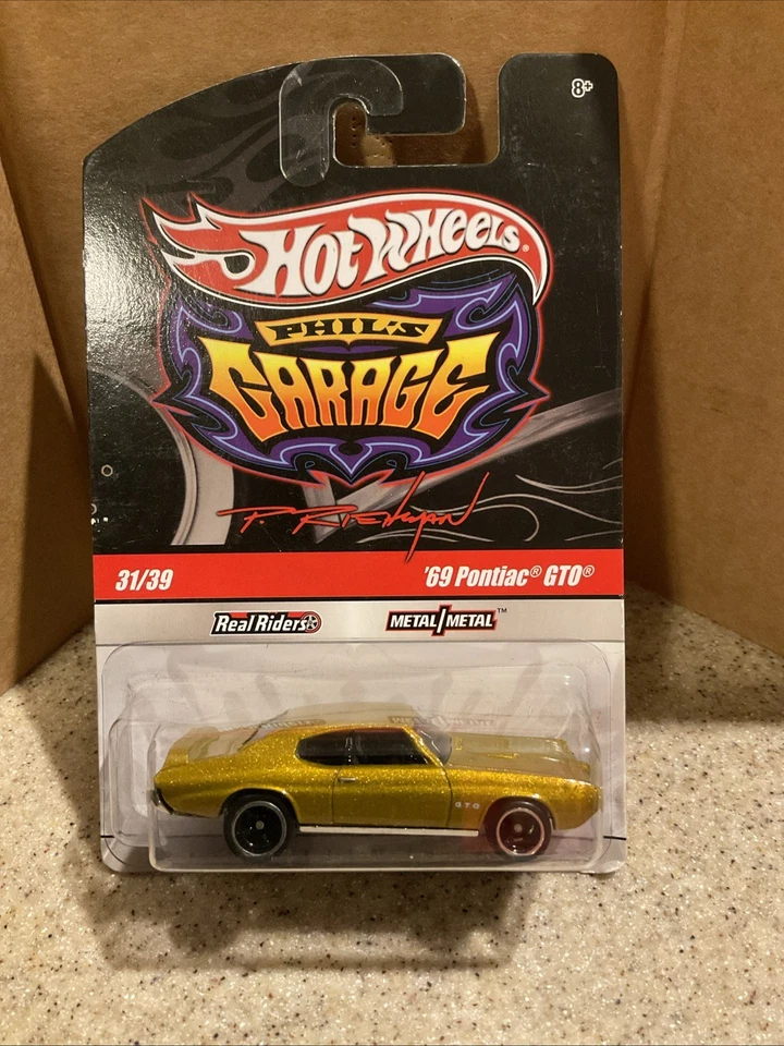 2009 Hot Wheels Phil's гараж серии ' 69 Pontiac GTO золото RRs 31/39 как новый на картонке - Изображение 1 из 1
